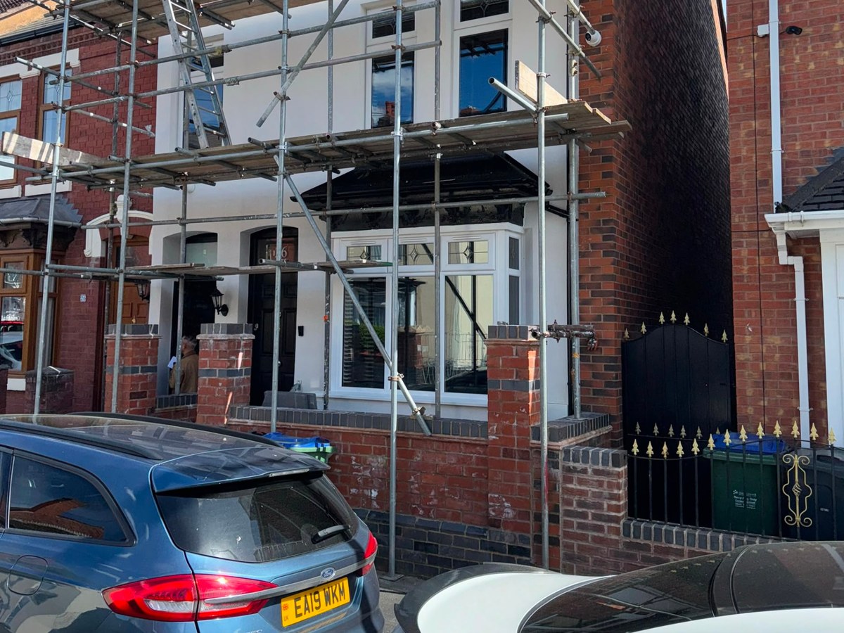 Front elevation render, Birmingham — Front elevation of the same property finished in crisp white render with the original brickwork and detailing kept clean.