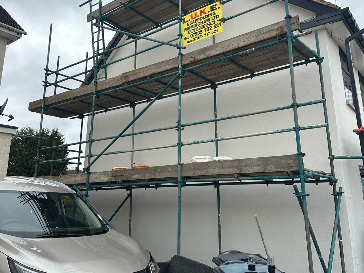 Re-rendered gable, Birmingham — Blown, peeling render stripped off the gable, substrate repaired and re-finished in a smooth white silicone render.