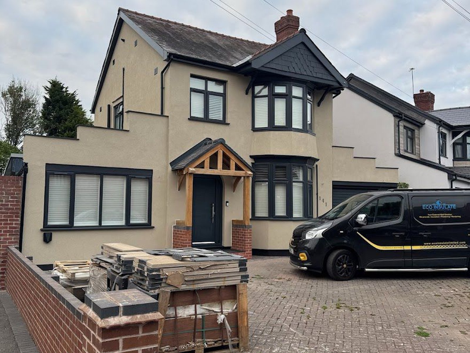 EWI + silicone render, Dudley — Failing painted render stripped, insulated and refinished in a warm cream silicone render.